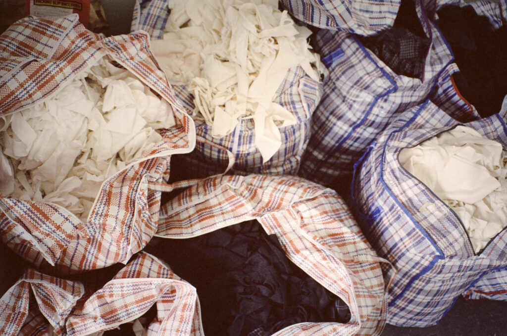 Bags of offcuts for textile recycling. Recyclable fabrics and recycling take back program by Circular Sourcing.
